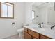 Bathroom with single vanity, wood cabinets, and a shower/tub at 8527 W Aster Dr, Peoria, AZ 85381