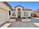 Single-story home with tile roof, attached garage, and landscaped front yard at 8527 W Aster Dr, Peoria, AZ 85381