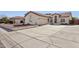 House with a two-car garage and well-maintained driveway at 8527 W Aster Dr, Peoria, AZ 85381