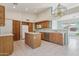 Kitchen boasts an island, stainless steel dishwasher, and ample cabinetry at 8527 W Aster Dr, Peoria, AZ 85381