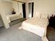 Main bedroom with mirrored closet doors and floral bedding at 867 E Lancaster Cir, Florence, AZ 85132