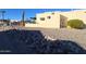 Landscaped yard with rock border at 867 E Lancaster Cir, Florence, AZ 85132