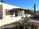 Exterior view of single story home with desert landscaping at 867 E Lancaster Cir, Florence, AZ 85132