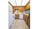 Well-lit kitchen with wood cabinets and white appliances at 867 E Lancaster Cir, Florence, AZ 85132