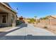 Landscaped backyard with concrete patio and desert plants at 88 E Macaw Ct, San Tan Valley, AZ 85143