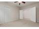 Spacious bedroom with double door closet and access to another room at 88 E Macaw Ct, San Tan Valley, AZ 85143