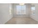 Bright dining area with tile floors and large window at 88 E Macaw Ct, San Tan Valley, AZ 85143