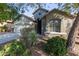 Two-story house with beige exterior, two car garage and mature landscaping at 88 E Macaw Ct, San Tan Valley, AZ 85143