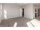 Neutral bedroom with carpet and views to the bathroom and hallway at 9227 E Sector Dr, Mesa, AZ 85212