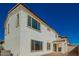 Exterior elevation of home showcasing the modern architecture and ample windows at 9227 E Sector Dr, Mesa, AZ 85212