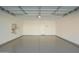 Large garage with epoxy flooring and ample space for storage at 9227 E Sector Dr, Mesa, AZ 85212