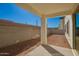 Covered patio with ample space overlooking the backyard at 9227 E Sector Dr, Mesa, AZ 85212