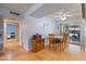 Bright dining area with wood table and four chairs at 9502 W Shasta Dr, Sun City, AZ 85351