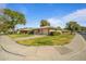 Front view of ranch home showcasing landscaping and driveway at 9502 W Shasta Dr, Sun City, AZ 85351