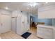 White kitchen with refrigerator, view of dining area at 9502 W Shasta Dr, Sun City, AZ 85351