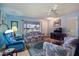 Living room with two floral couches and recliner at 9502 W Shasta Dr, Sun City, AZ 85351