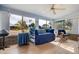 Sunroom with tiled floors, daybed and views of backyard at 9502 W Shasta Dr, Sun City, AZ 85351