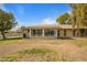 Sunroom addition with brick base and large windows at 9502 W Shasta Dr, Sun City, AZ 85351