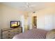 Bright bedroom with ceiling fan and dresser at 9708 E Via Linda -- # 2313, Scottsdale, AZ 85258