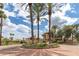 Landscaped entrance to the community with palm trees at 9708 E Via Linda -- # 2313, Scottsdale, AZ 85258