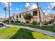 Two-story condo building with lush landscaping and palm trees at 9708 E Via Linda -- # 2313, Scottsdale, AZ 85258