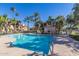 Community swimming pool with surrounding patio furniture at 9708 E Via Linda -- # 2313, Scottsdale, AZ 85258