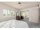 Bedroom with mirrored closet doors and window shutters at 9920 W Shasta Dr, Sun City, AZ 85351