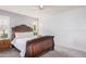 Bedroom with wood bed frame, window shutters and neutral wall at 9920 W Shasta Dr, Sun City, AZ 85351