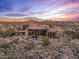 Luxury home with pool and mountain views at sunset at 10473 E Greythorn Dr, Scottsdale, AZ 85262