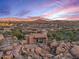 Luxury home nestled in desert landscape with mountain views at 10473 E Greythorn Dr, Scottsdale, AZ 85262