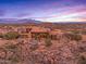 Luxury estate home with scenic mountain views at sunset at 10473 E Greythorn Dr, Scottsdale, AZ 85262