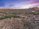 High-angle view of luxury estate, pool, and golf course at 10473 E Greythorn Dr, Scottsdale, AZ 85262