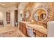 Bathroom with vanity, toilet and decorative mirrors at 10473 E Greythorn Dr, Scottsdale, AZ 85262