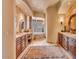 Luxurious bathroom with double vanities and a soaking tub at 10473 E Greythorn Dr, Scottsdale, AZ 85262