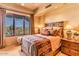 Charming bedroom with mountain views and rustic decor at 10473 E Greythorn Dr, Scottsdale, AZ 85262