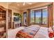 Primary bedroom with stunning mountain views and private access at 10473 E Greythorn Dr, Scottsdale, AZ 85262