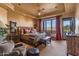 Primary bedroom with mountain views and rustic decor at 10473 E Greythorn Dr, Scottsdale, AZ 85262