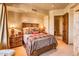 Cozy bedroom with rustic wood furniture and southwestern bedding at 10473 E Greythorn Dr, Scottsdale, AZ 85262