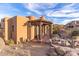 Exterior view of a casita with a covered patio and seating area at 10473 E Greythorn Dr, Scottsdale, AZ 85262