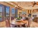 Rustic dining area with a wooden table and chairs, offering scenic views at 10473 E Greythorn Dr, Scottsdale, AZ 85262