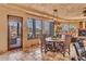 Spacious dining area with views and access to patio at 10473 E Greythorn Dr, Scottsdale, AZ 85262