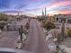 Long private driveway leading to a beautiful estate in a luxurious community at 10473 E Greythorn Dr, Scottsdale, AZ 85262