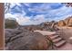 Elevated patio with seating and stunning panoramic mountain views at 10473 E Greythorn Dr, Scottsdale, AZ 85262