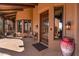 Elegant entryway with a wooden door and large windows at 10473 E Greythorn Dr, Scottsdale, AZ 85262