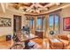 Spacious home office features built-in shelves and wood desk at 10473 E Greythorn Dr, Scottsdale, AZ 85262