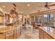 Open kitchen with large island and breakfast nook, views and high end finishes at 10473 E Greythorn Dr, Scottsdale, AZ 85262