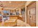 Kitchen features granite counters,farmhouse sink, custom cabinetry and high end appliances at 10473 E Greythorn Dr, Scottsdale, AZ 85262