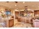 Eat-in kitchen with island, custom cabinetry and high end finishes at 10473 E Greythorn Dr, Scottsdale, AZ 85262