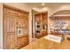 Stainless steel appliances and custom wood cabinetry in kitchen at 10473 E Greythorn Dr, Scottsdale, AZ 85262