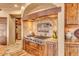 Gourmet kitchen with stainless steel appliances and custom wood cabinetry at 10473 E Greythorn Dr, Scottsdale, AZ 85262